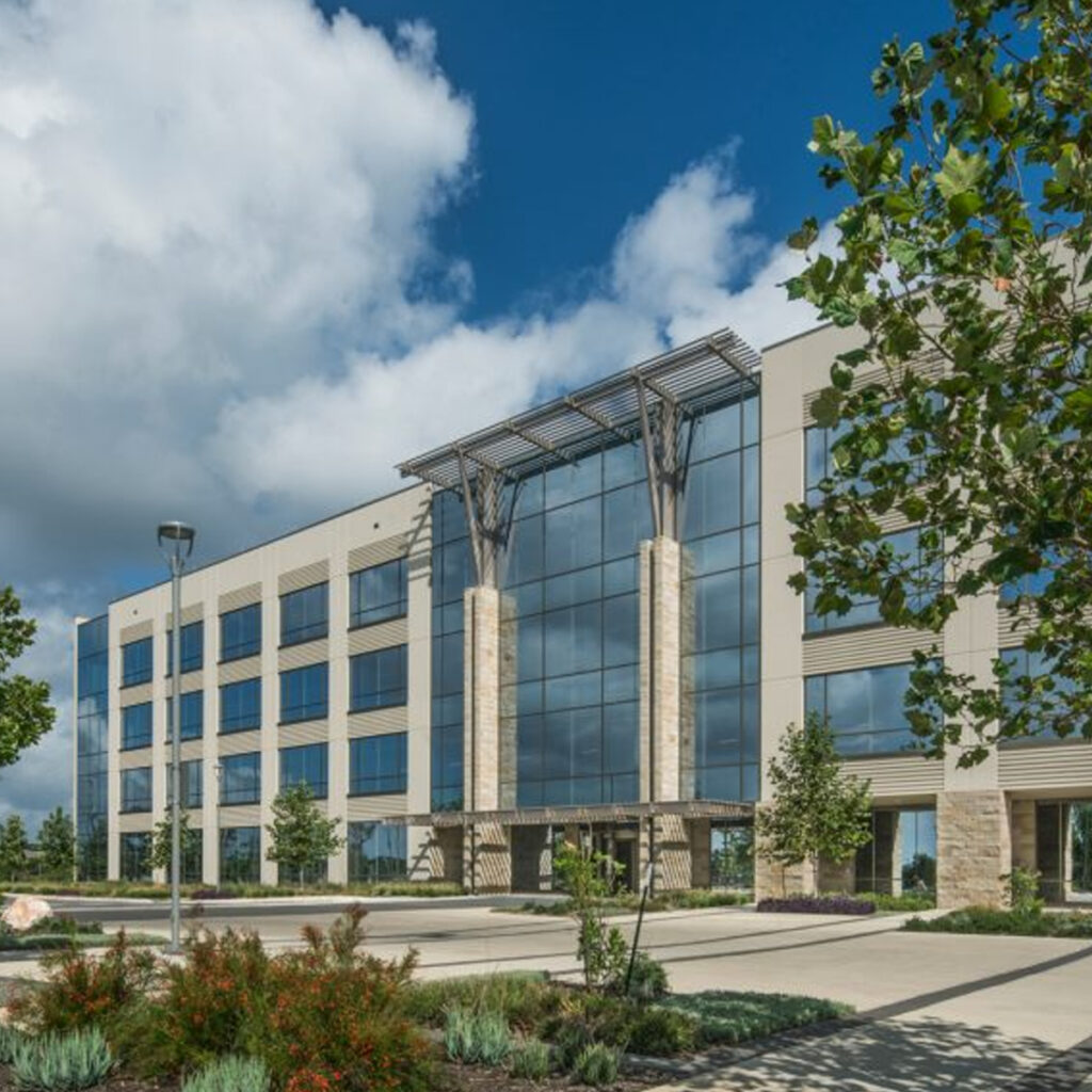 Westridge Two 4-story office building with glass and stone front.