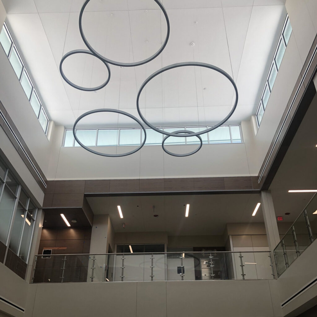 Welcome center interior with circular hanging lights.